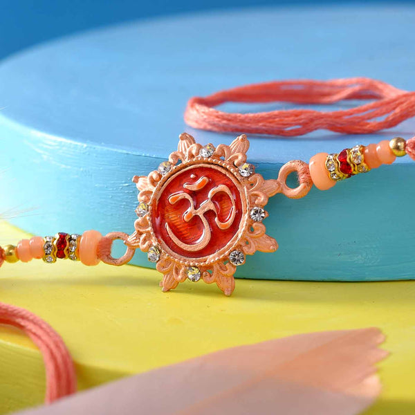 Om Rakhi In Peach Color Thread