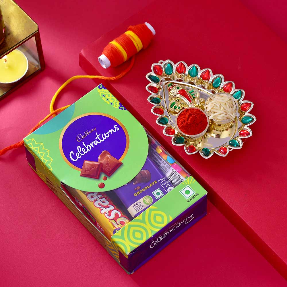 Blissful Hamper With Chocolate, Ganesha Thali, Thread, Roli Chawal & Tikka