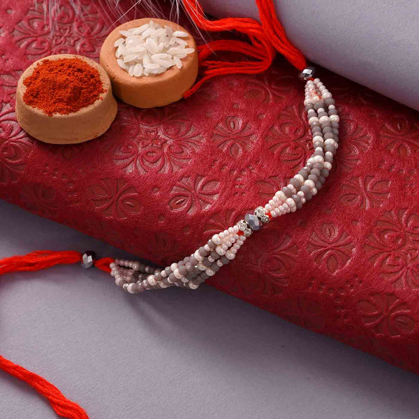 Alluring Pearls Rakhi With Mewa Bites