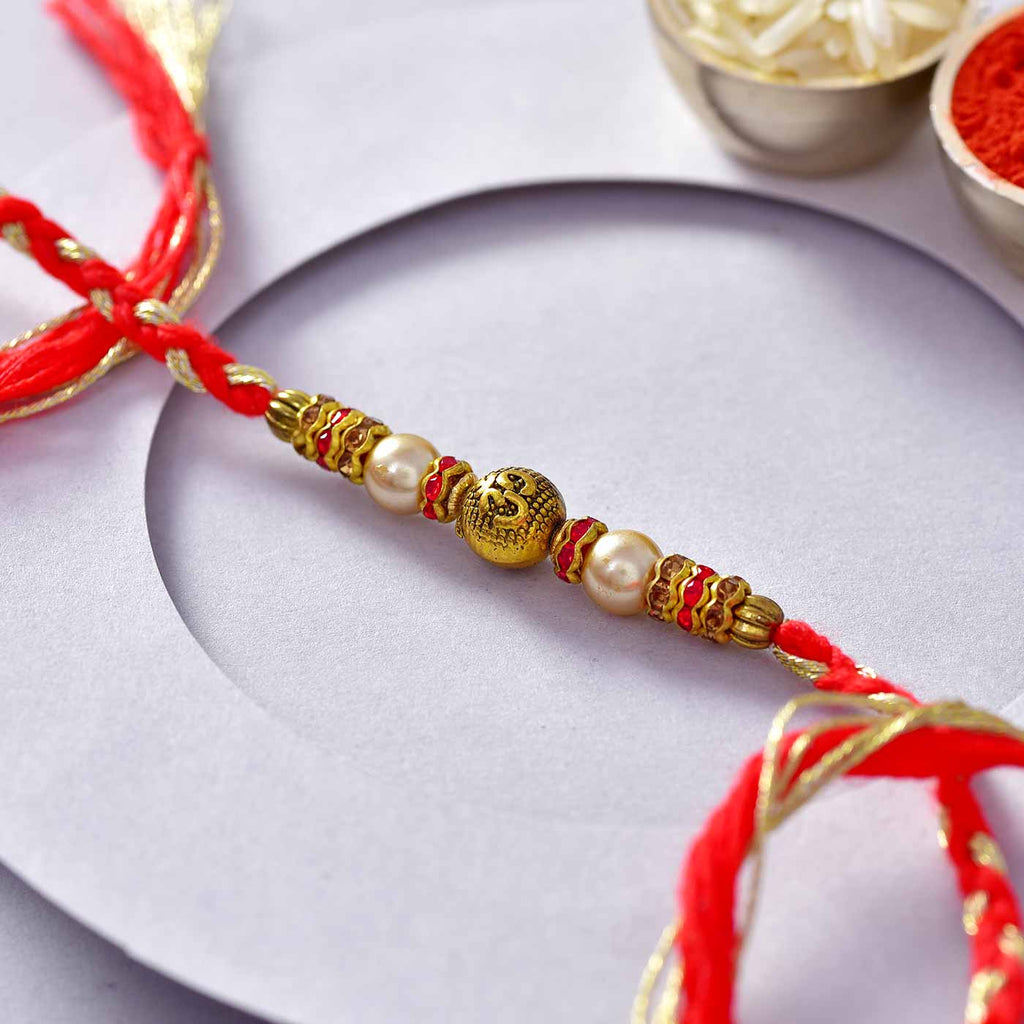 Traditional Om Antique Bead & Pearls Rakhi Thread