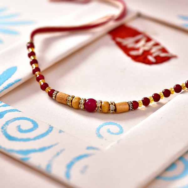 Fascinating Wooden & Dark Red Beads Rakhi Thread