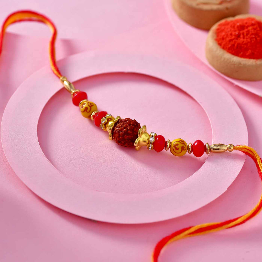 Ethnic Rudraksha Rakhi Thread With Yellow Om & Red Beads