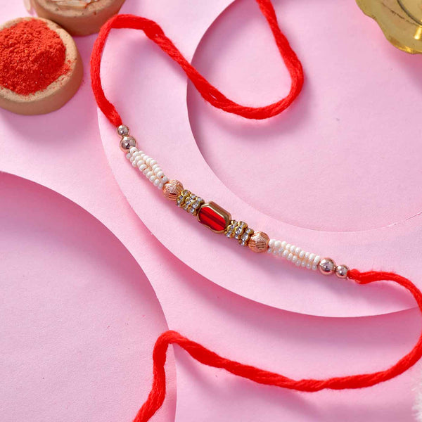 Golden & White Beads Rakhi Thread With Red Stone