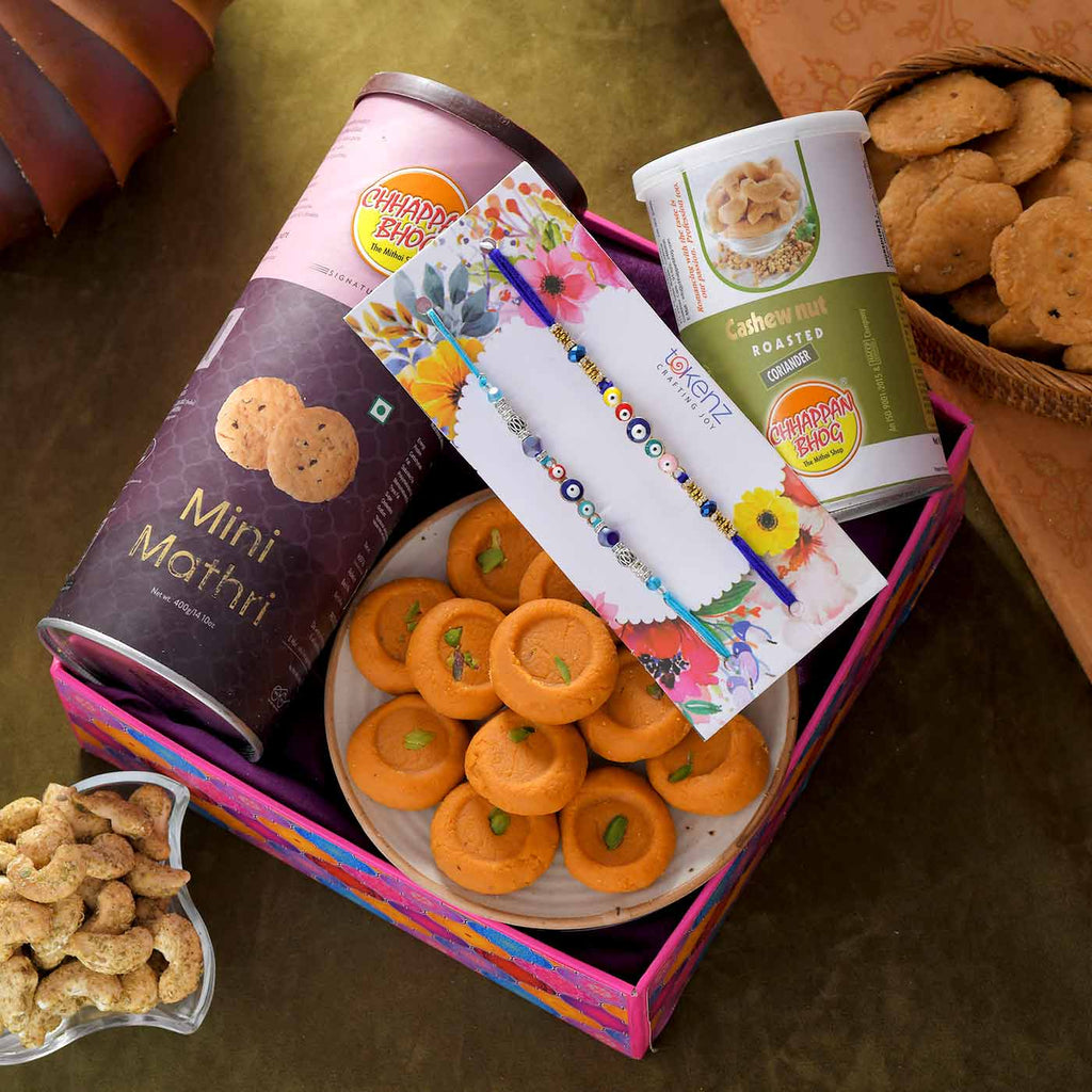 Charming Set Of 2 Evil Eye Rakhi With Snacks, Savoury & Box