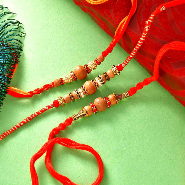 Sandalwood Beads Set Of 3 Rakhis With Mewa Bites & Panjiri Laddoo