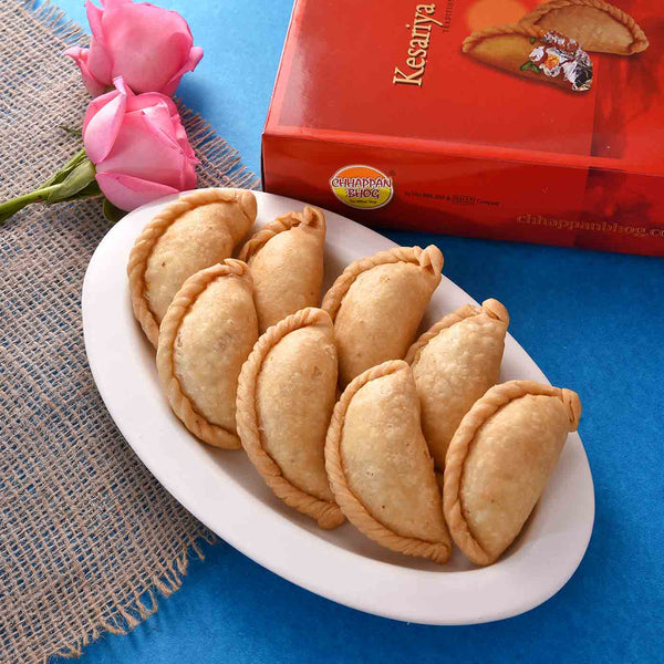 Mouthwatering Dry Gujiya Combo With Set of 2 Fragrant Silk Gulal