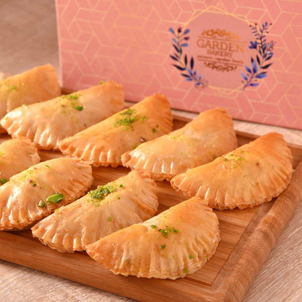 Exotic Hamper Of Turkish Gujiya With Vibrant Silk Gulal