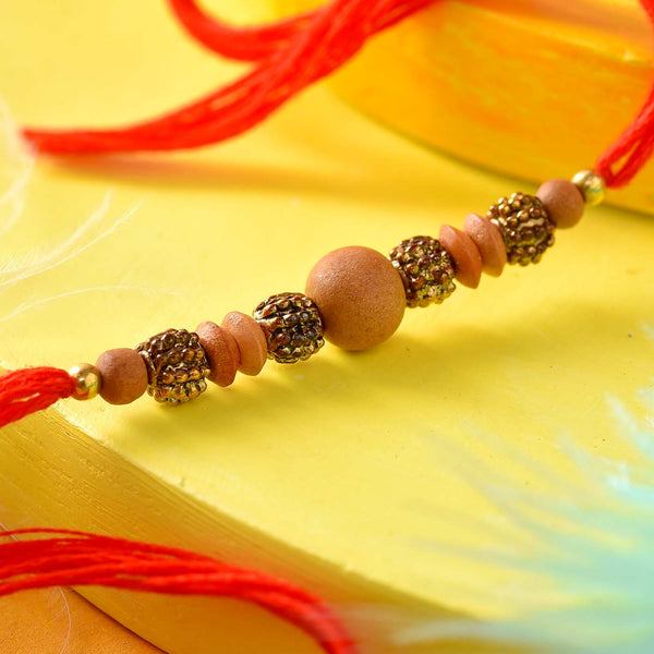 Metal & Wooden Beads Rakhi In Red Thread