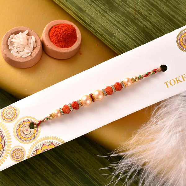Stunning Pearls & Beads Rakhi With Batisa Slice