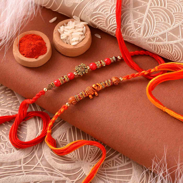 Elegant Set Of 2 Beads Rakhi With CANs Of Flavored Cashewnuts